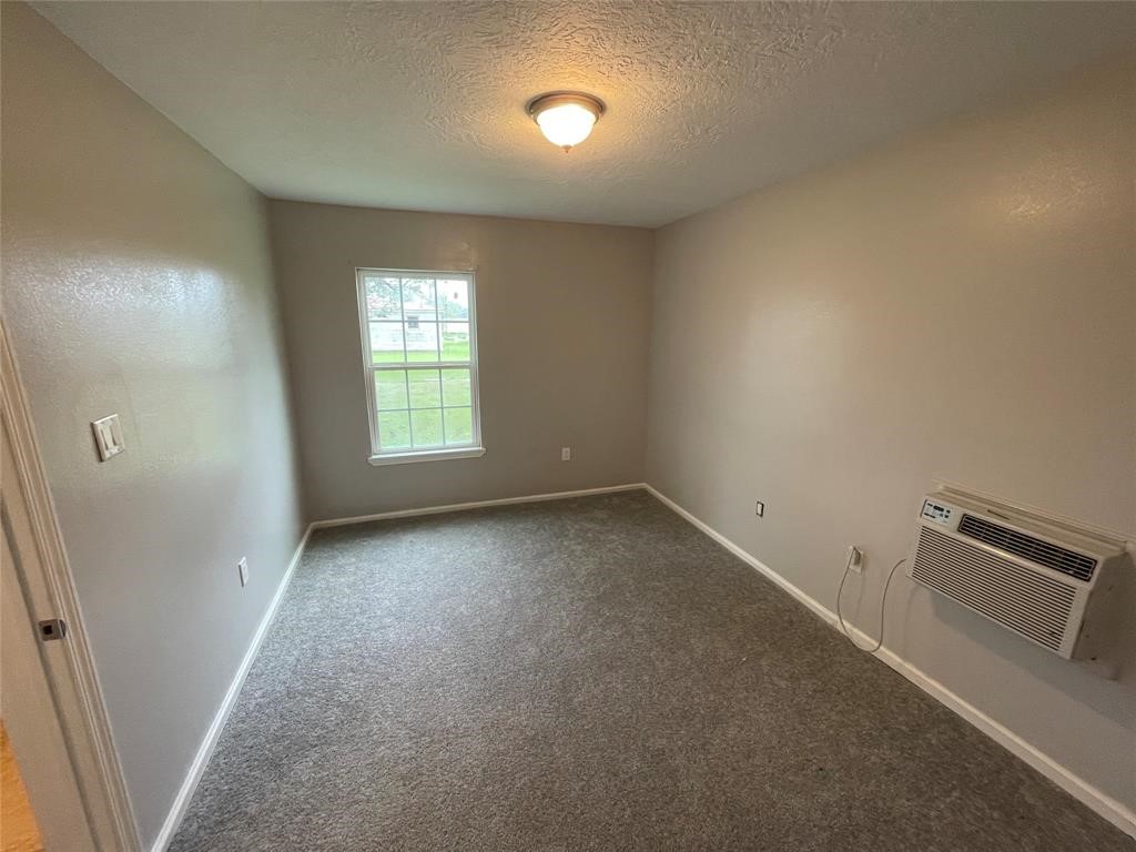 1708 West 5th Street Freeport, TX 77541 - Photo 8 of 9 an empty room with a window