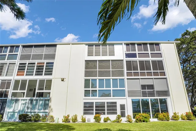 a view of a swimming pool with an outdoor space and seating area