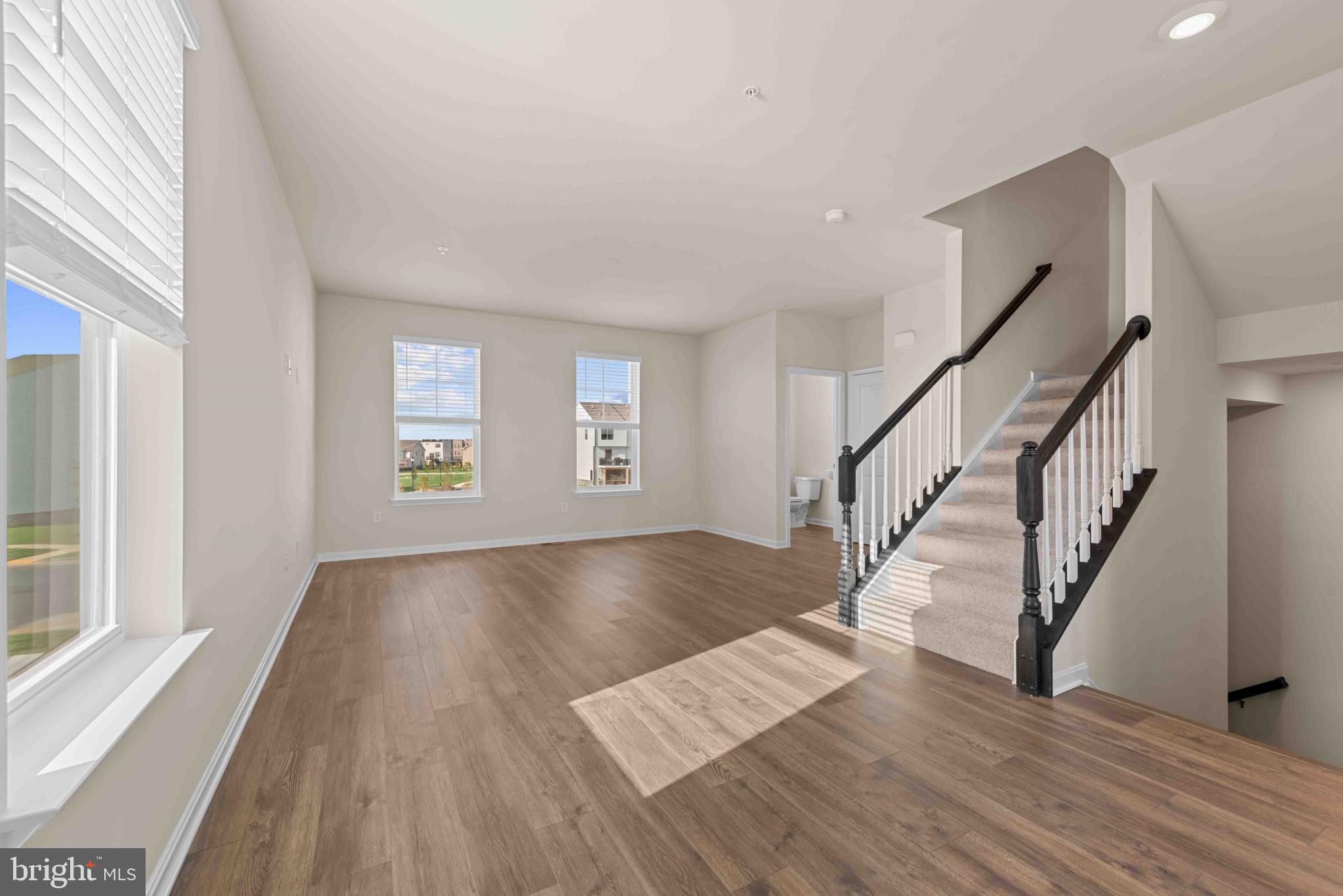 377 Ensemble Way Frederick, MD 21701 - Photo 13 of 45 a view of entryway and hall with wooden floor