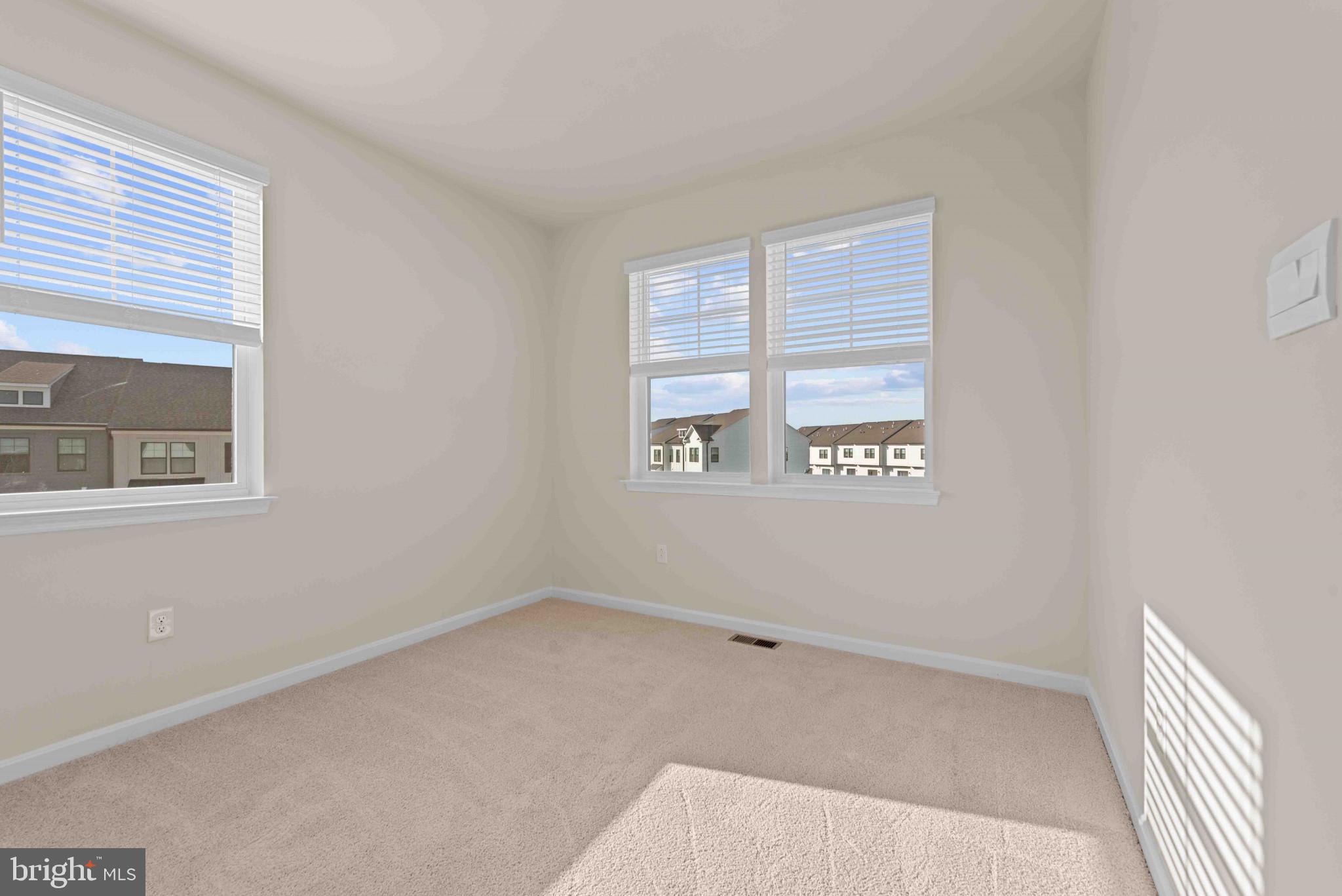 377 Ensemble Way Frederick, MD 21701 - Photo 19 of 45 a view of an empty room with a window