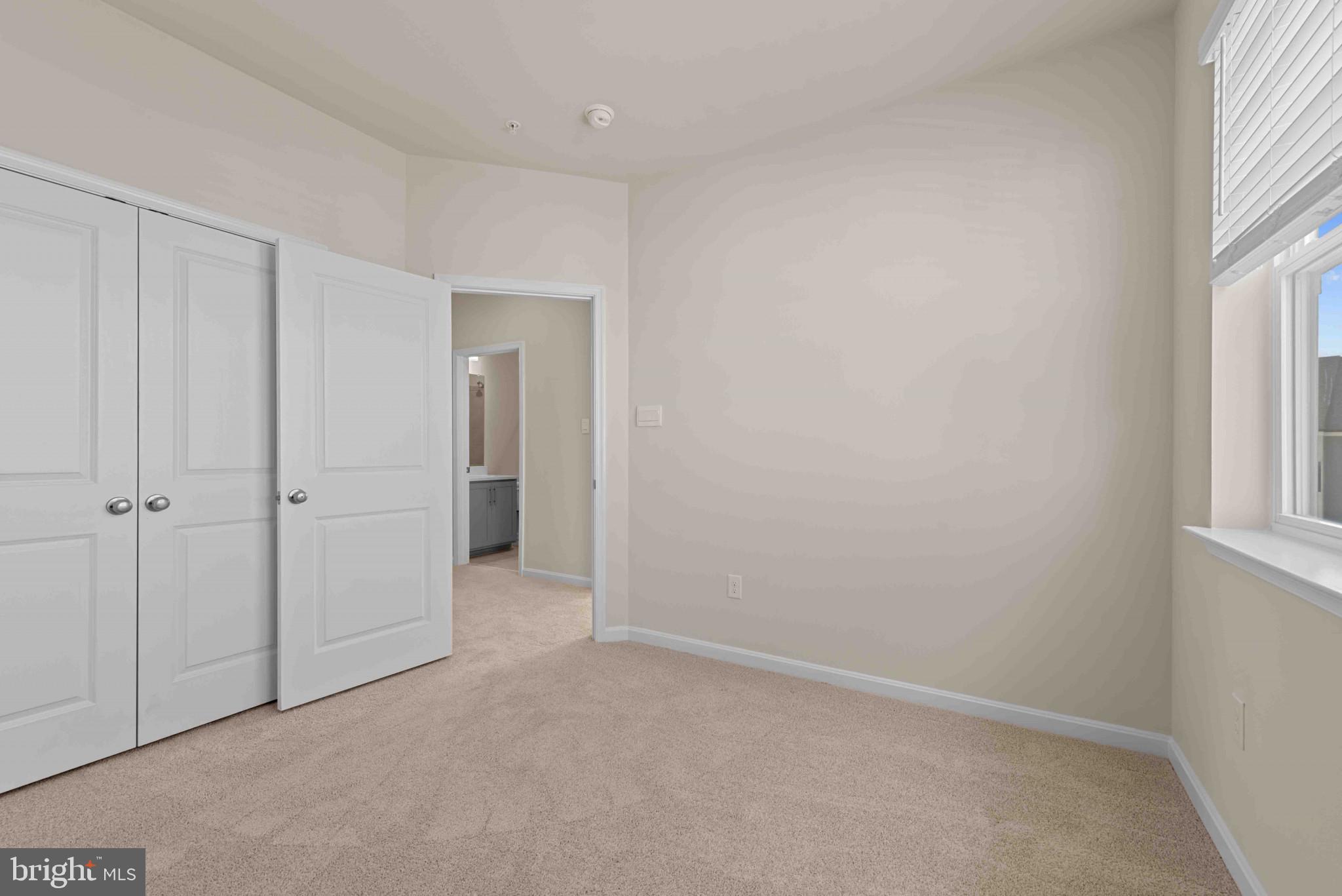 377 Ensemble Way Frederick, MD 21701 - Photo 23 of 45 a view of an empty room with windows and closet