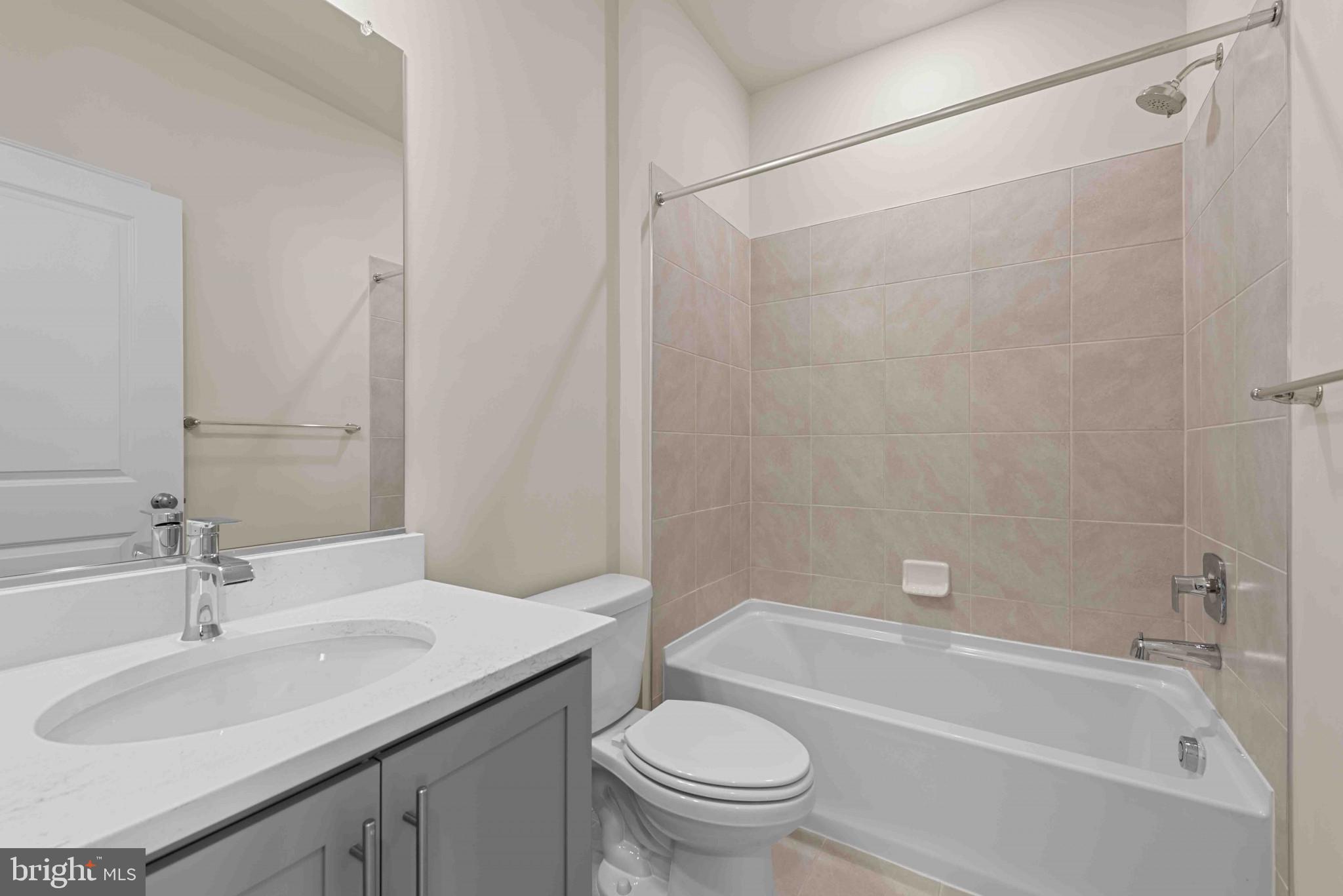 377 Ensemble Way Frederick, MD 21701 - Photo 25 of 45 a bathroom with a sink toilet and shower
