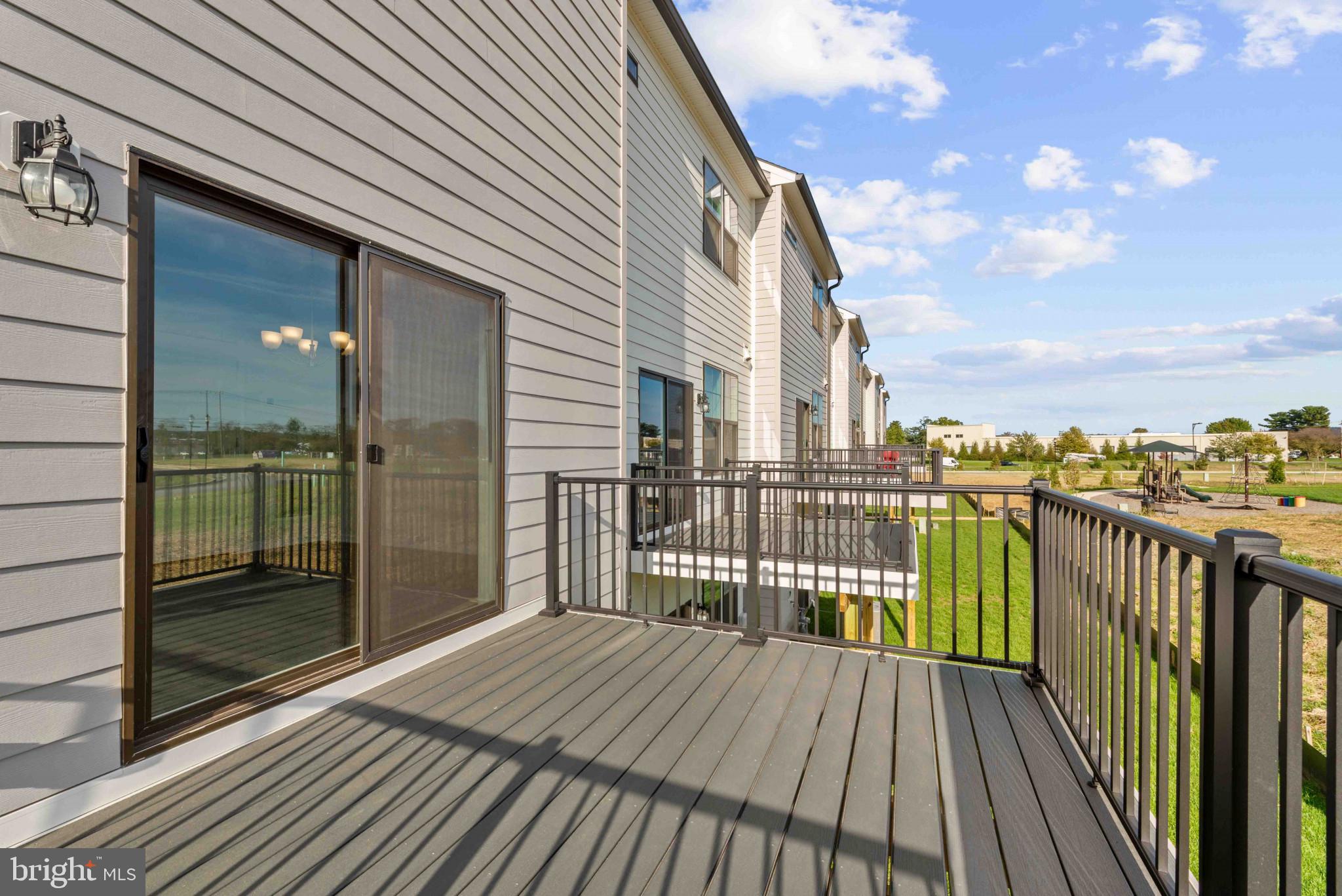 377 Ensemble Way Frederick, MD 21701 - Photo 31 of 45 a view of a balcony with wooden floor and fence