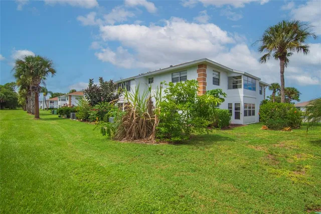 an aerial view of a house with a garden