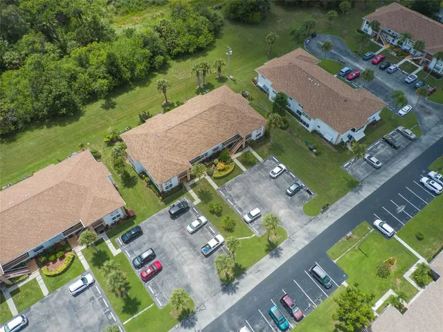 an aerial view of a houses with outdoor space