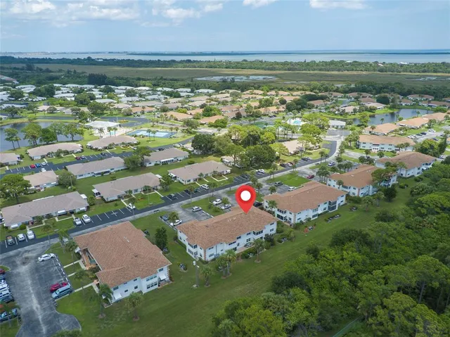 an aerial view of city and lake view
