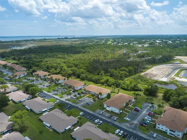 an aerial view of a house with yard swimming pool and outdoor seating