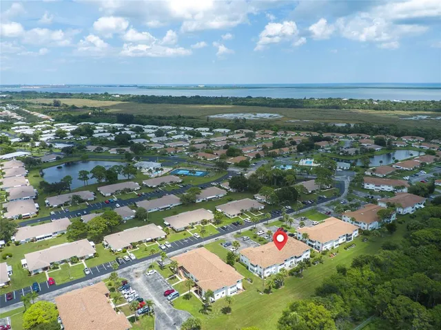 an aerial view of a house with yard swimming pool and outdoor seating