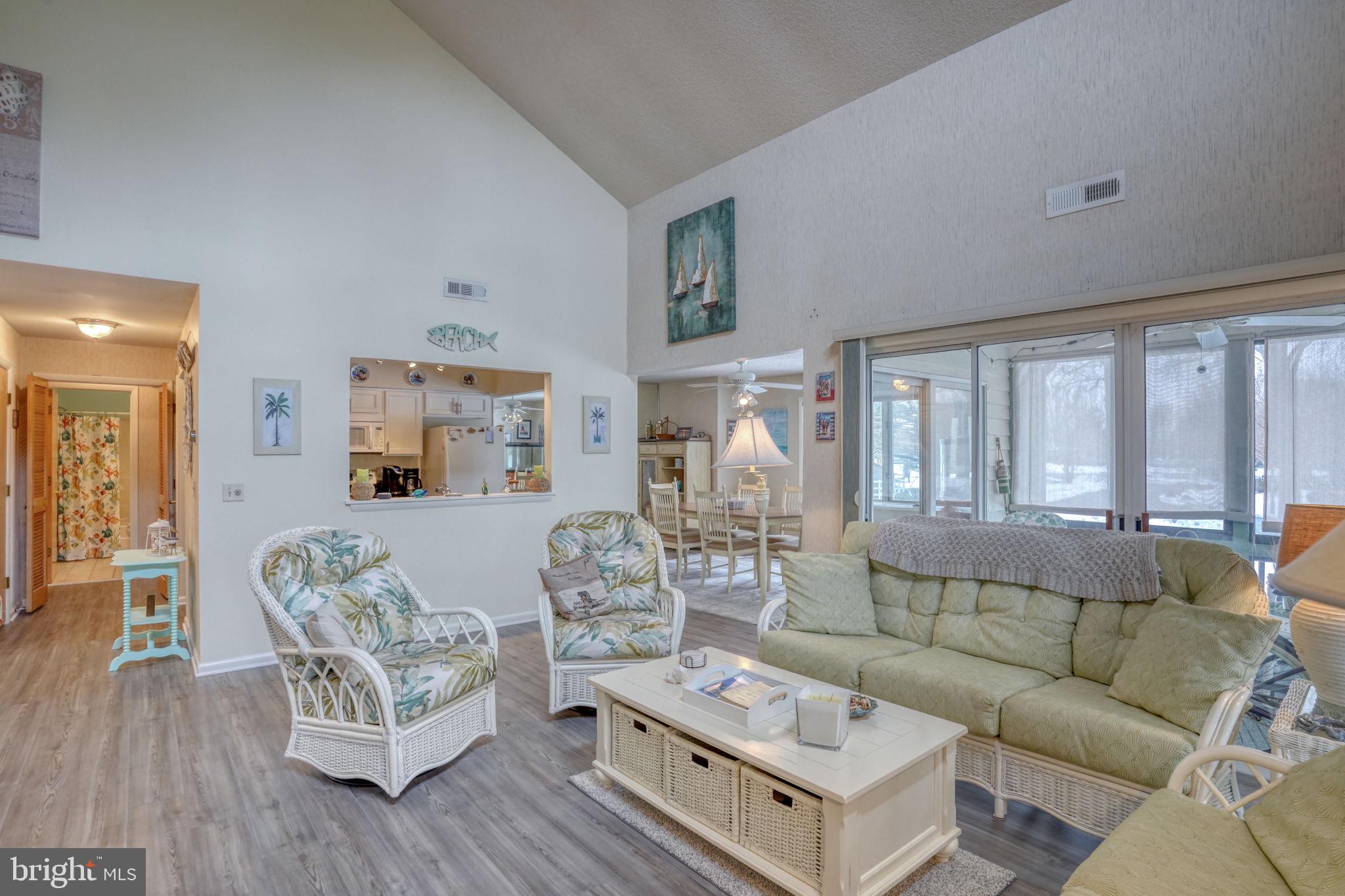 18488 Belle Grove Road, Unit 3 Lewes, DE 19958 - Photo 12 of 48 a living room with furniture and wooden floor