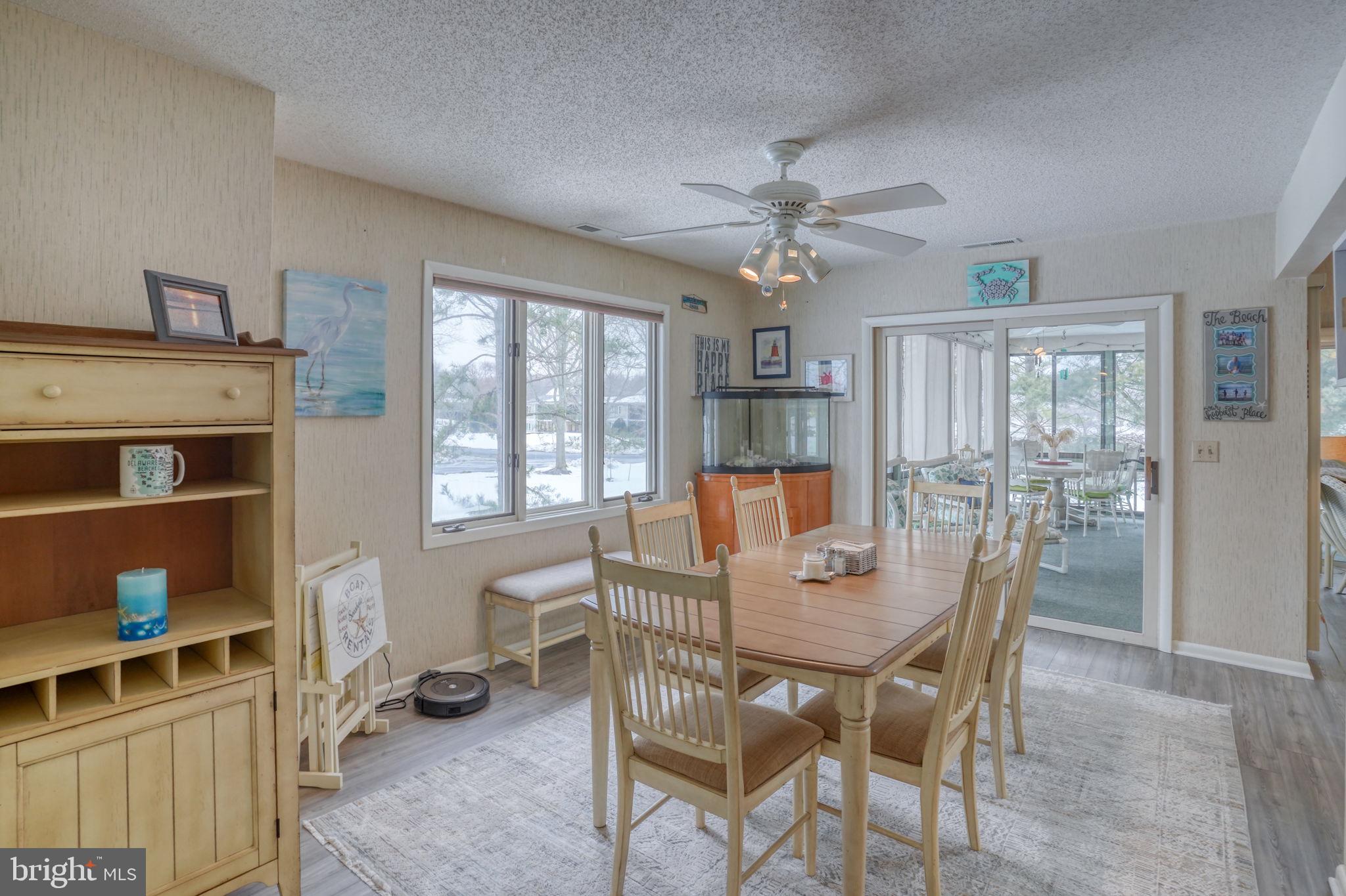 18488 Belle Grove Road, Unit 3 Lewes, DE 19958 - Photo 21 of 48 a view of a dining room with furniture window and outside view