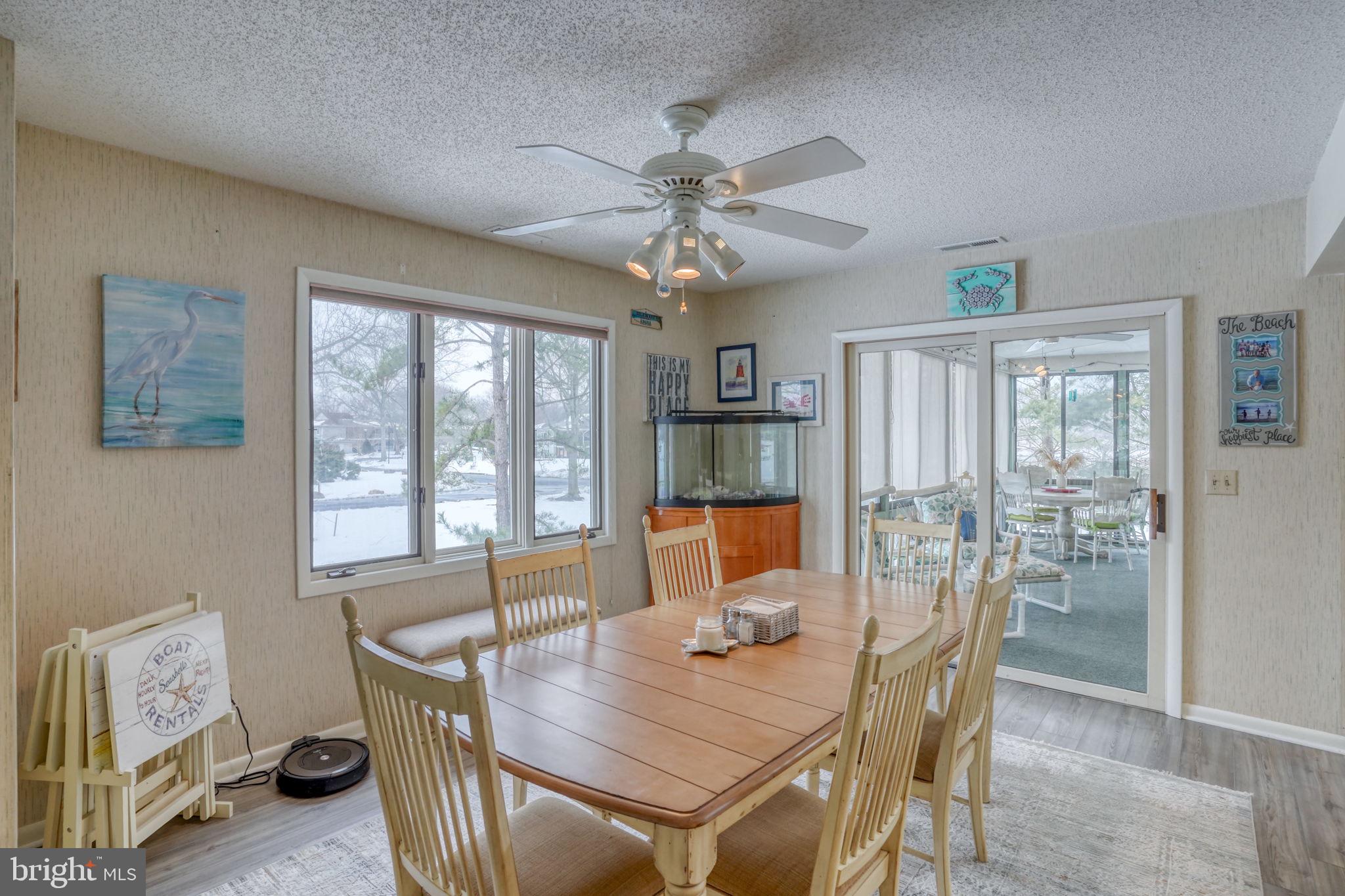 18488 Belle Grove Road, Unit 3 Lewes, DE 19958 - Photo 23 of 48 a view of a dining room with furniture window and outside view