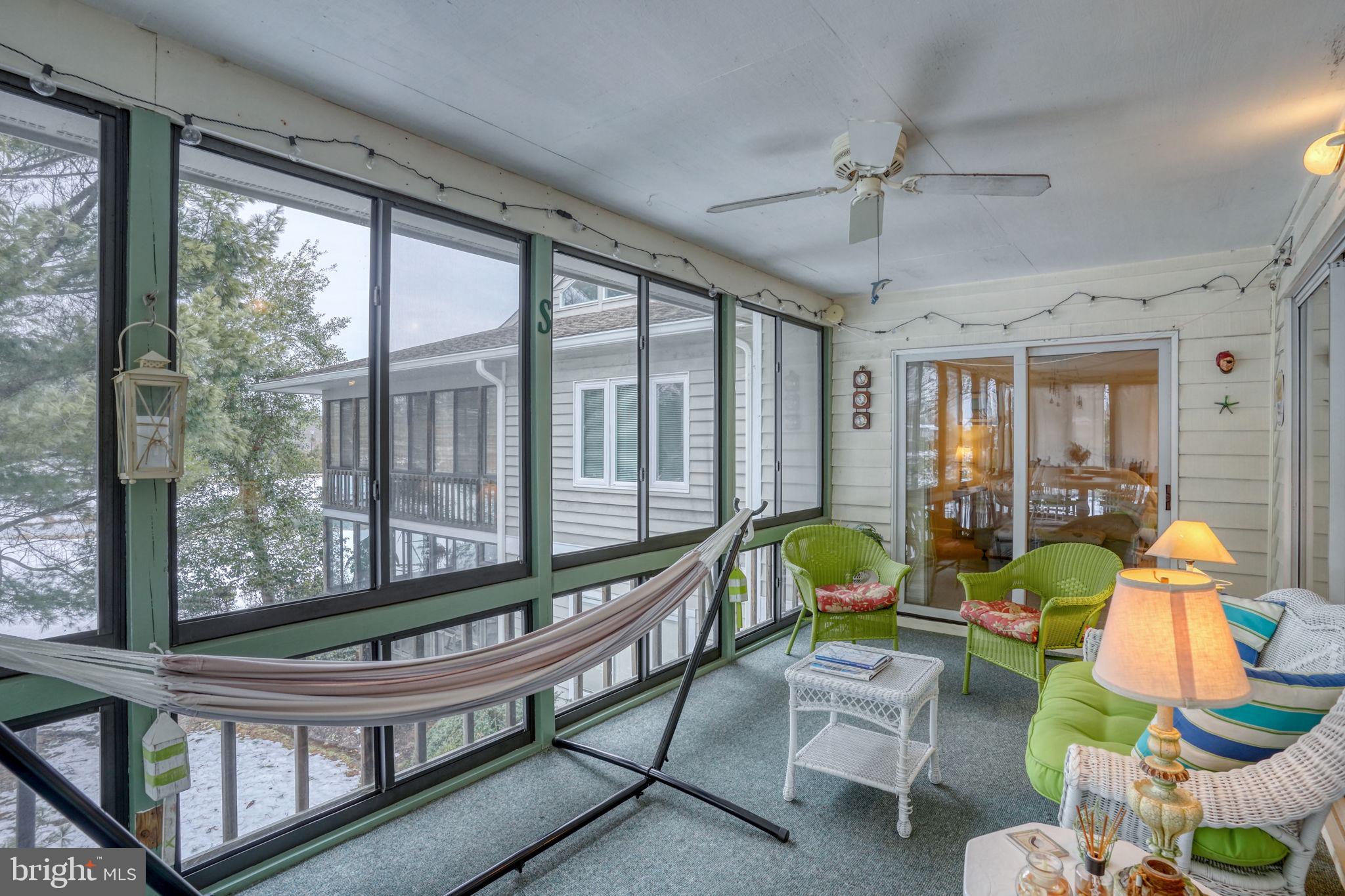 18488 Belle Grove Road, Unit 3 Lewes, DE 19958 - Photo 25 of 48 a living room with furniture and a large window