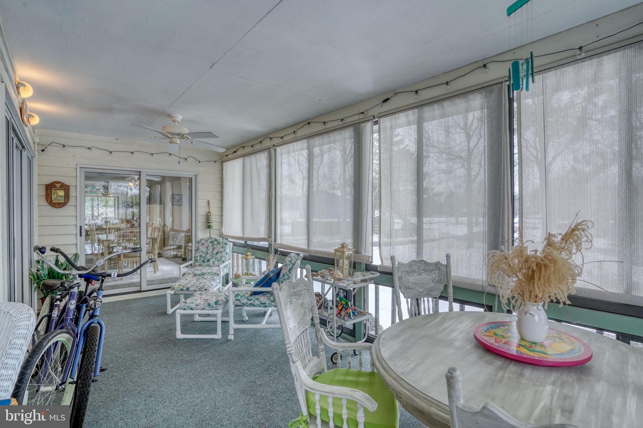 18488 Belle Grove Road, Unit 3 Lewes, DE 19958 - Photo 27 of 48 a dining room with furniture mountain view and wooden floor