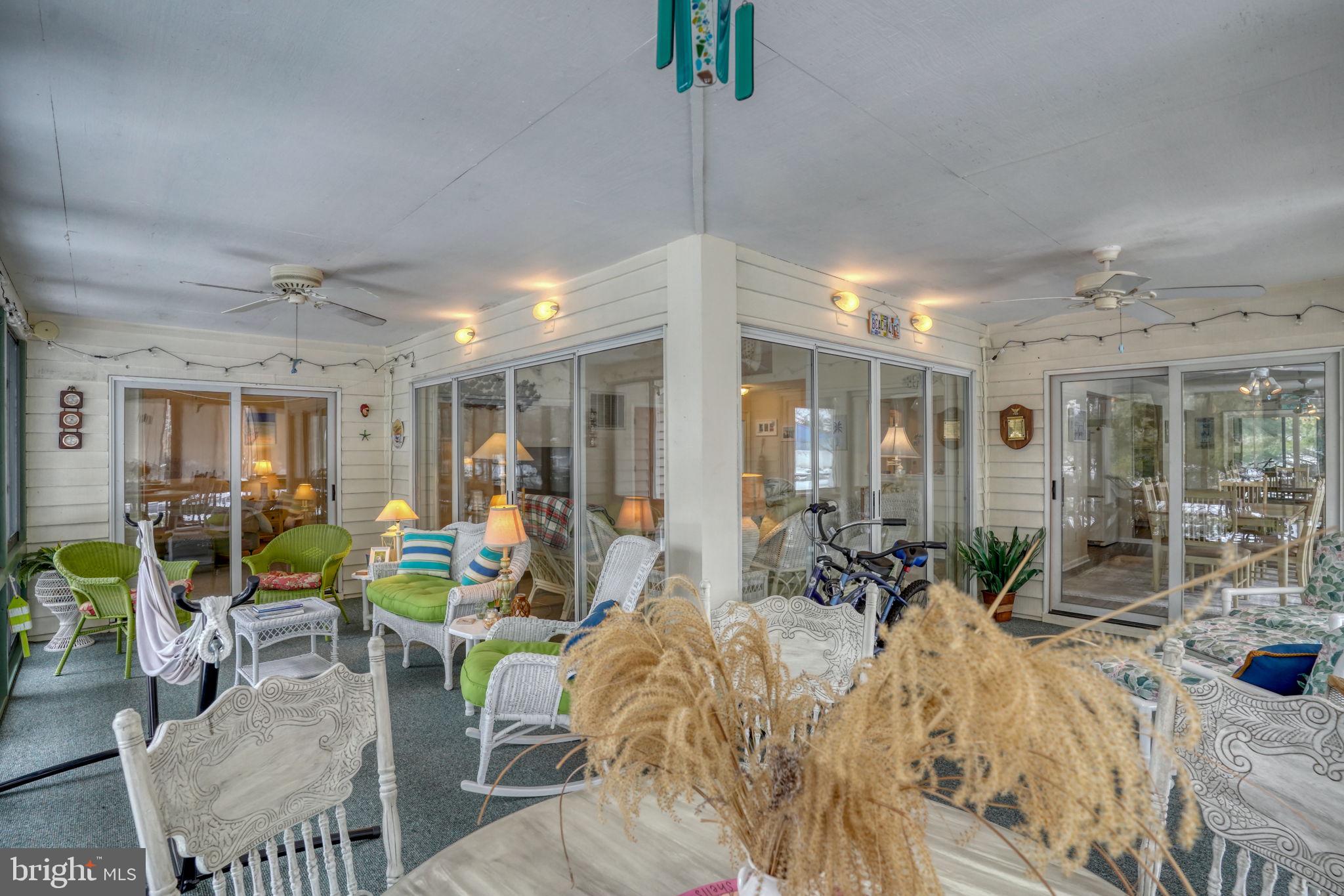 18488 Belle Grove Road, Unit 3 Lewes, DE 19958 - Photo 28 of 48 a view of a dining room with furniture window and outside view