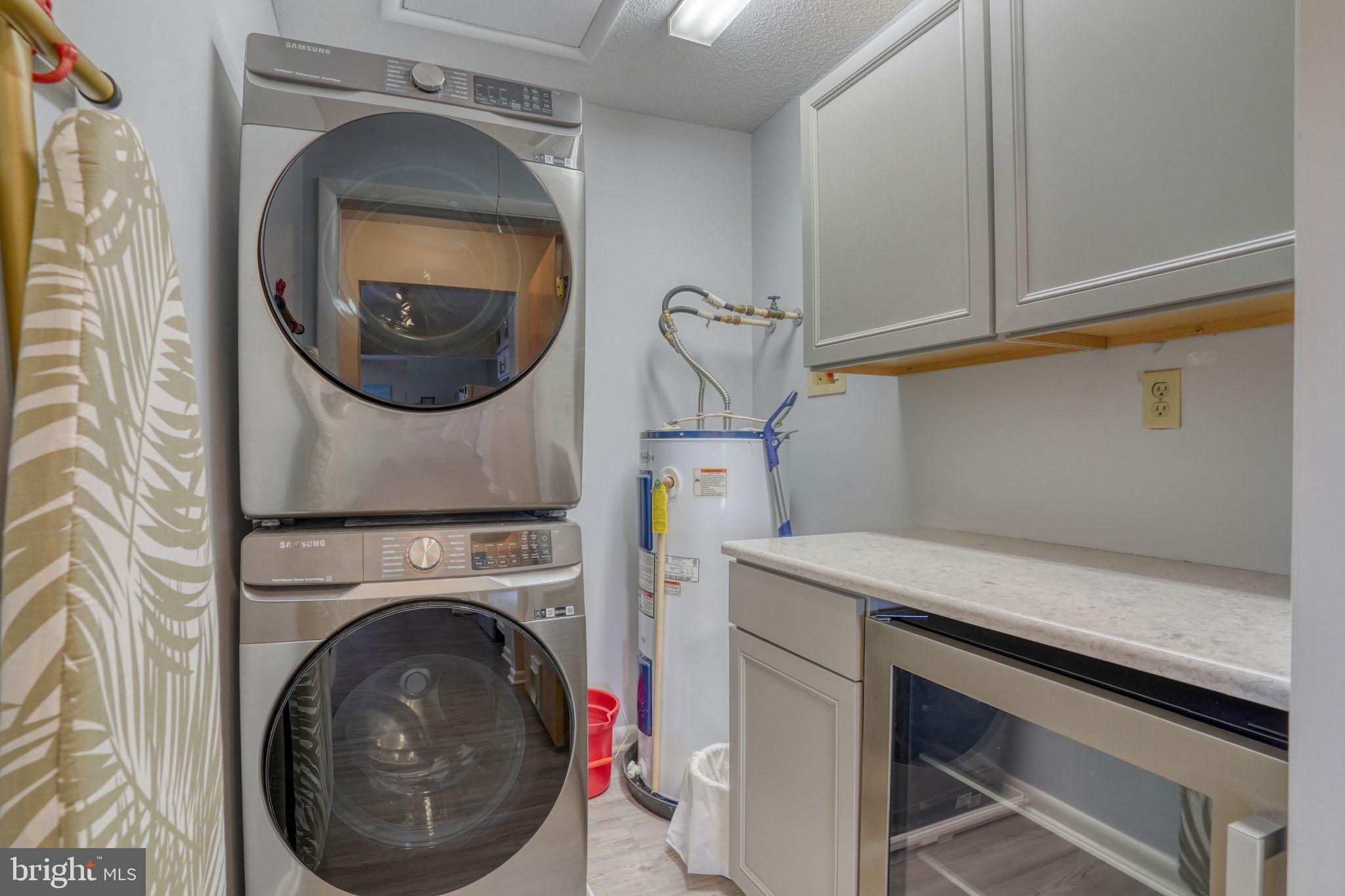 18488 Belle Grove Road, Unit 3 Lewes, DE 19958 - Photo 43 of 48 a utility room with dryer and washer