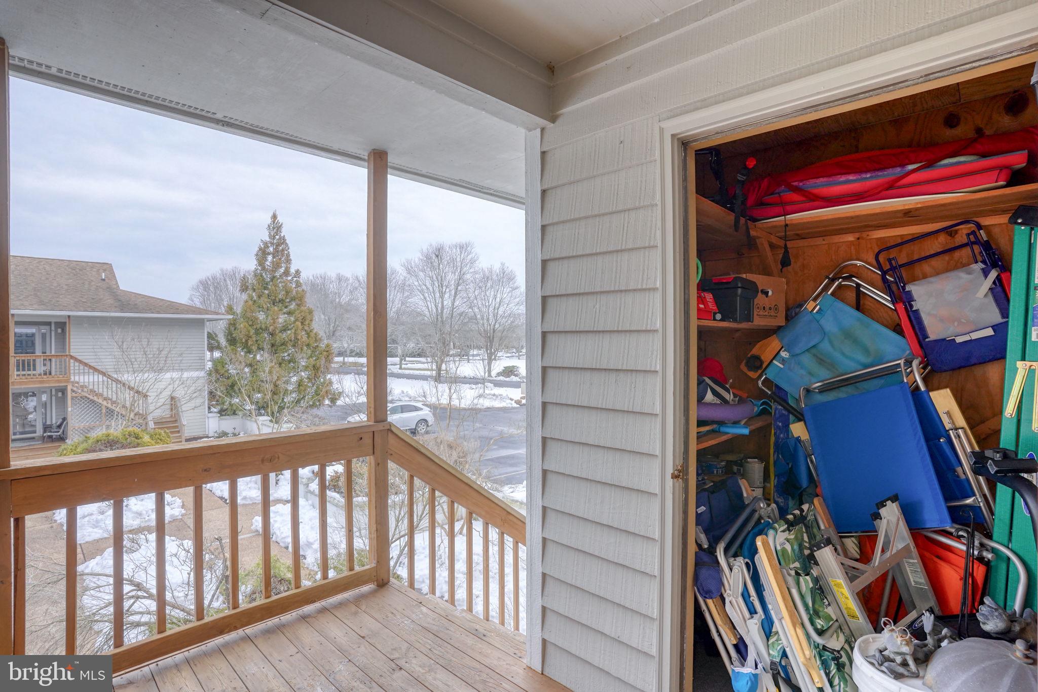 18488 Belle Grove Road, Unit 3 Lewes, DE 19958 - Photo 44 of 48 a view of a living room with clothes and shoes