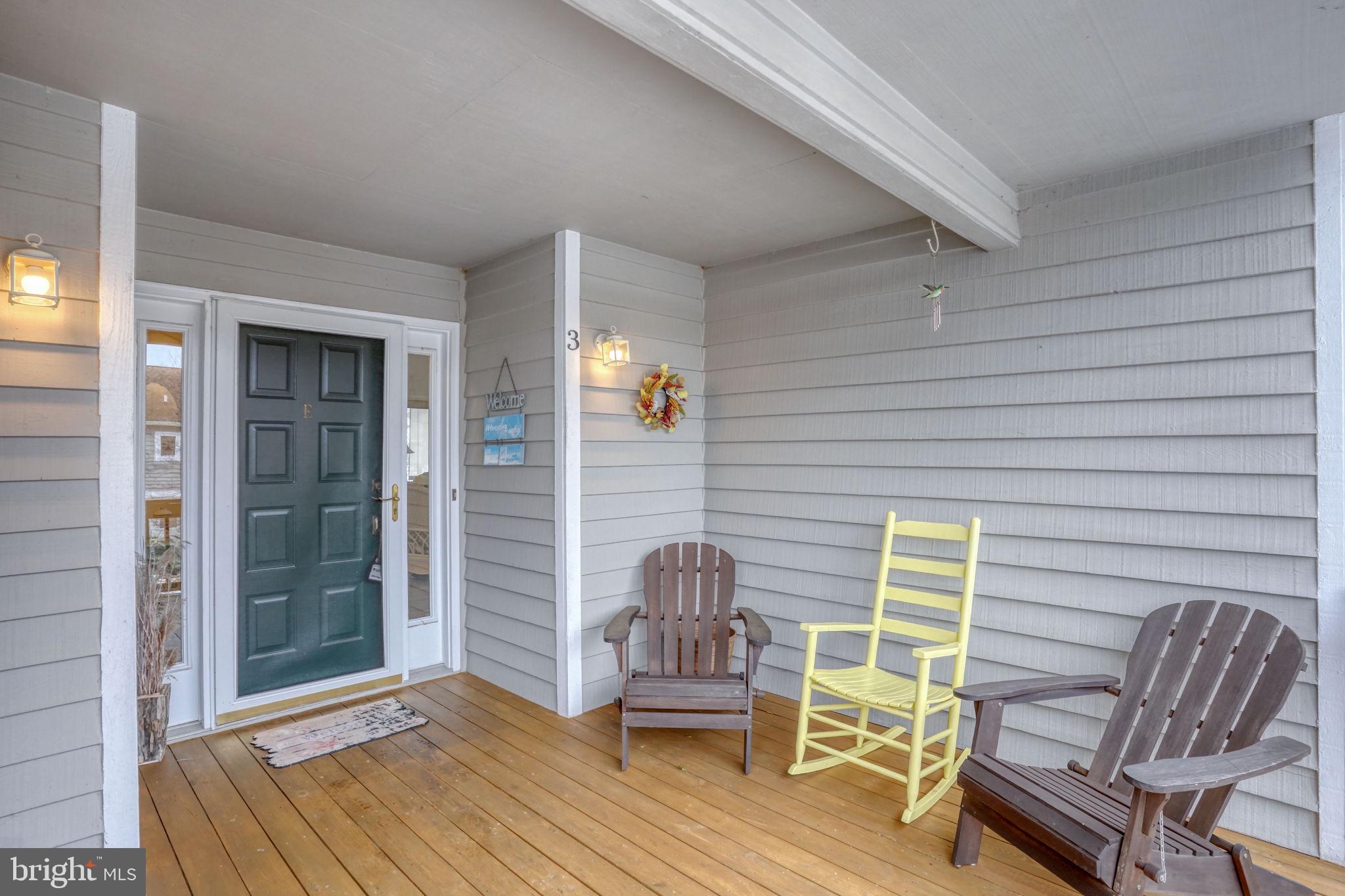 18488 Belle Grove Road, Unit 3 Lewes, DE 19958 - Photo 5 of 48 a deck view with a seating space