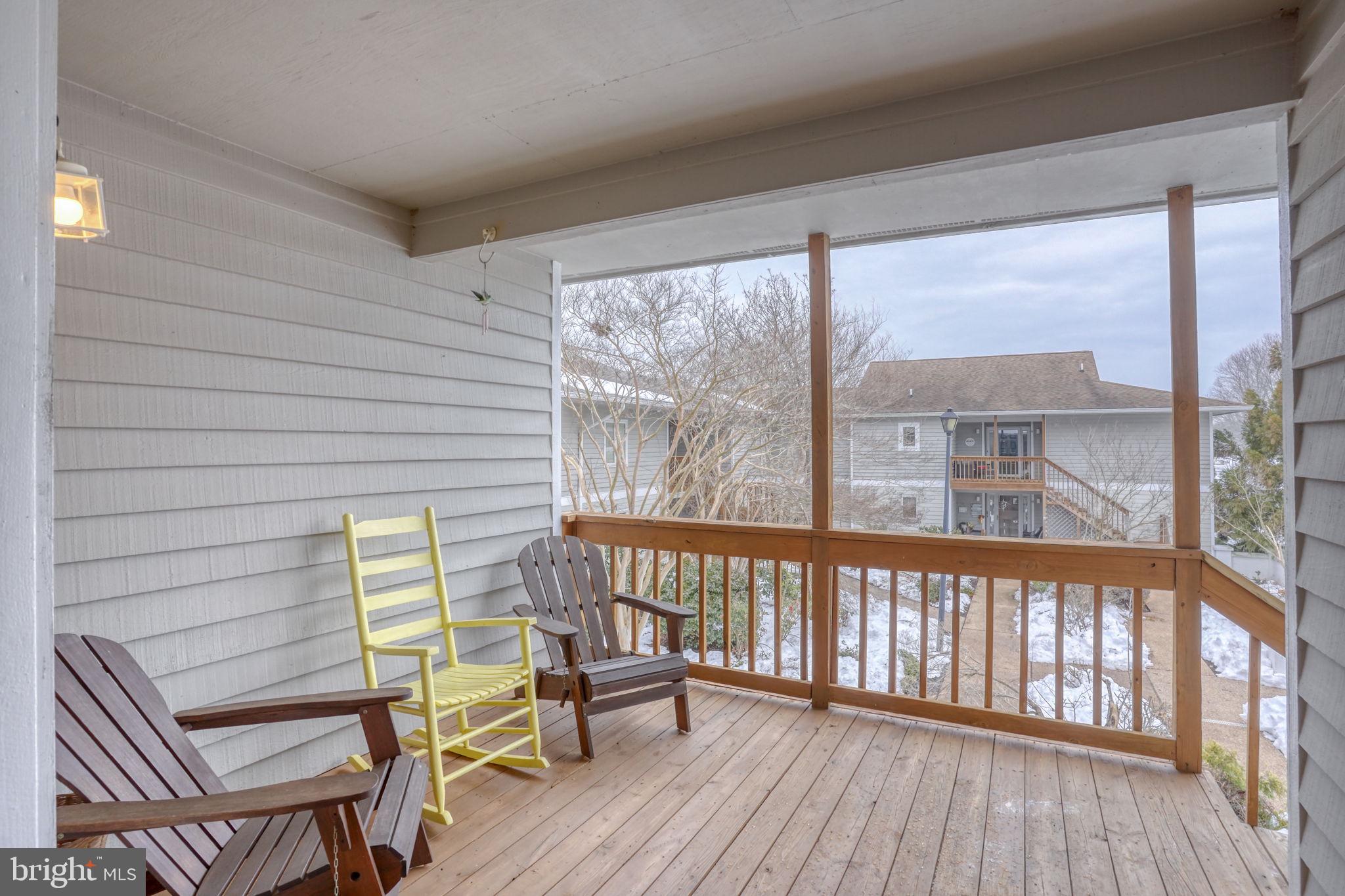 18488 Belle Grove Road, Unit 3 Lewes, DE 19958 - Photo 6 of 48 a view of a two chairs in the balcony