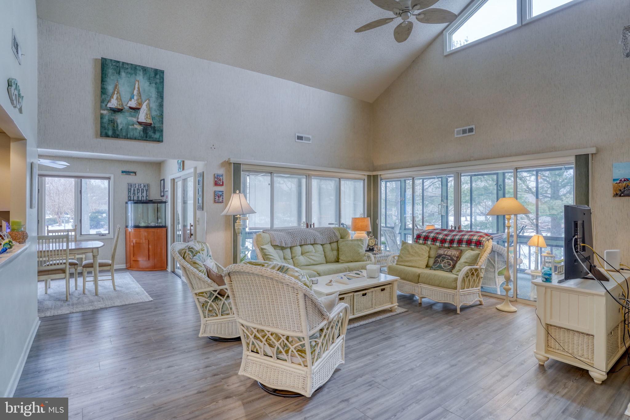 18488 Belle Grove Road, Unit 3 Lewes, DE 19958 - Photo 8 of 48 a living room with furniture and a wooden floor