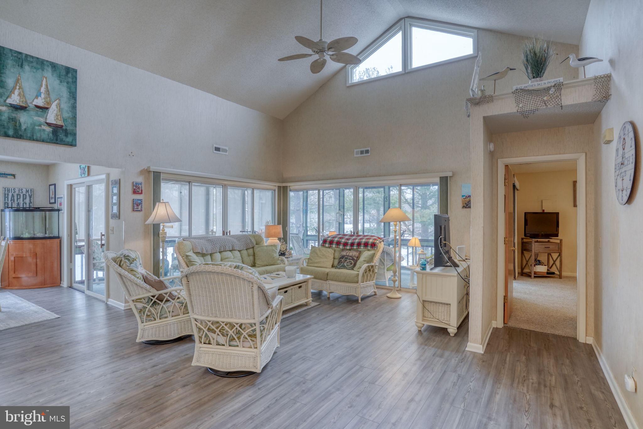 18488 Belle Grove Road, Unit 3 Lewes, DE 19958 - Photo 9 of 48 a living room with furniture and a wooden floor