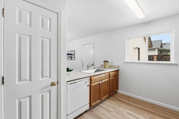 a view of a bathroom with a sink and a mirror