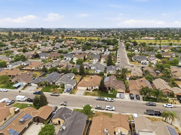 an aerial view of residential houses with outdoor space
