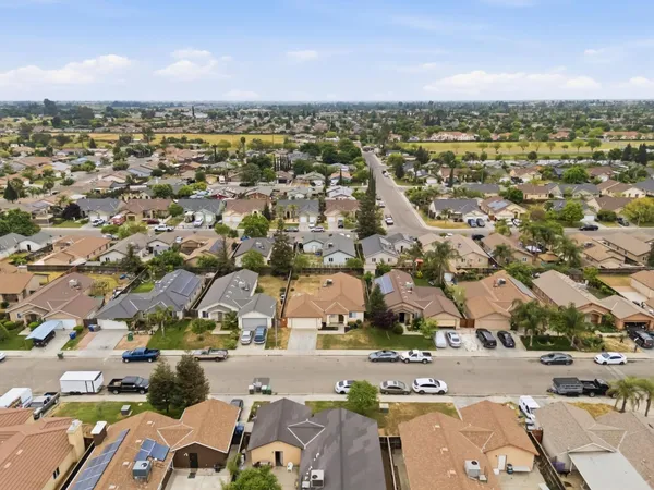 an aerial view of residential houses with outdoor space