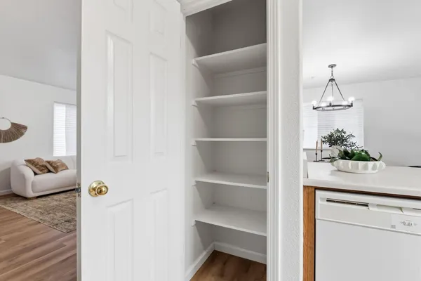 a view of living room with furniture and potted plant