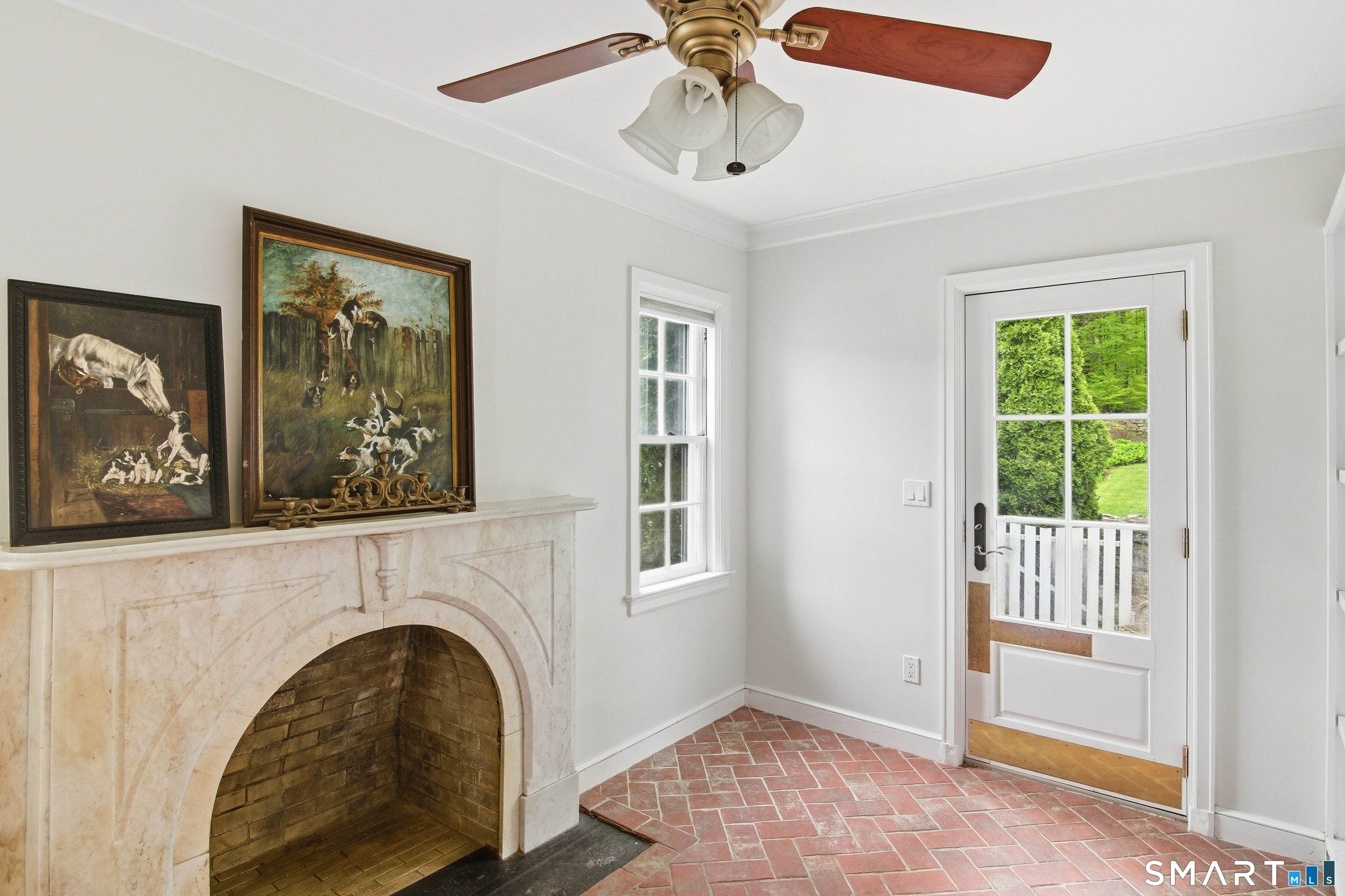433 Wrights Crossing Road Pomfret, CT 06259 - Photo 23 of 36 Side door opens into the mudroom. The fireplace is from a bygone era