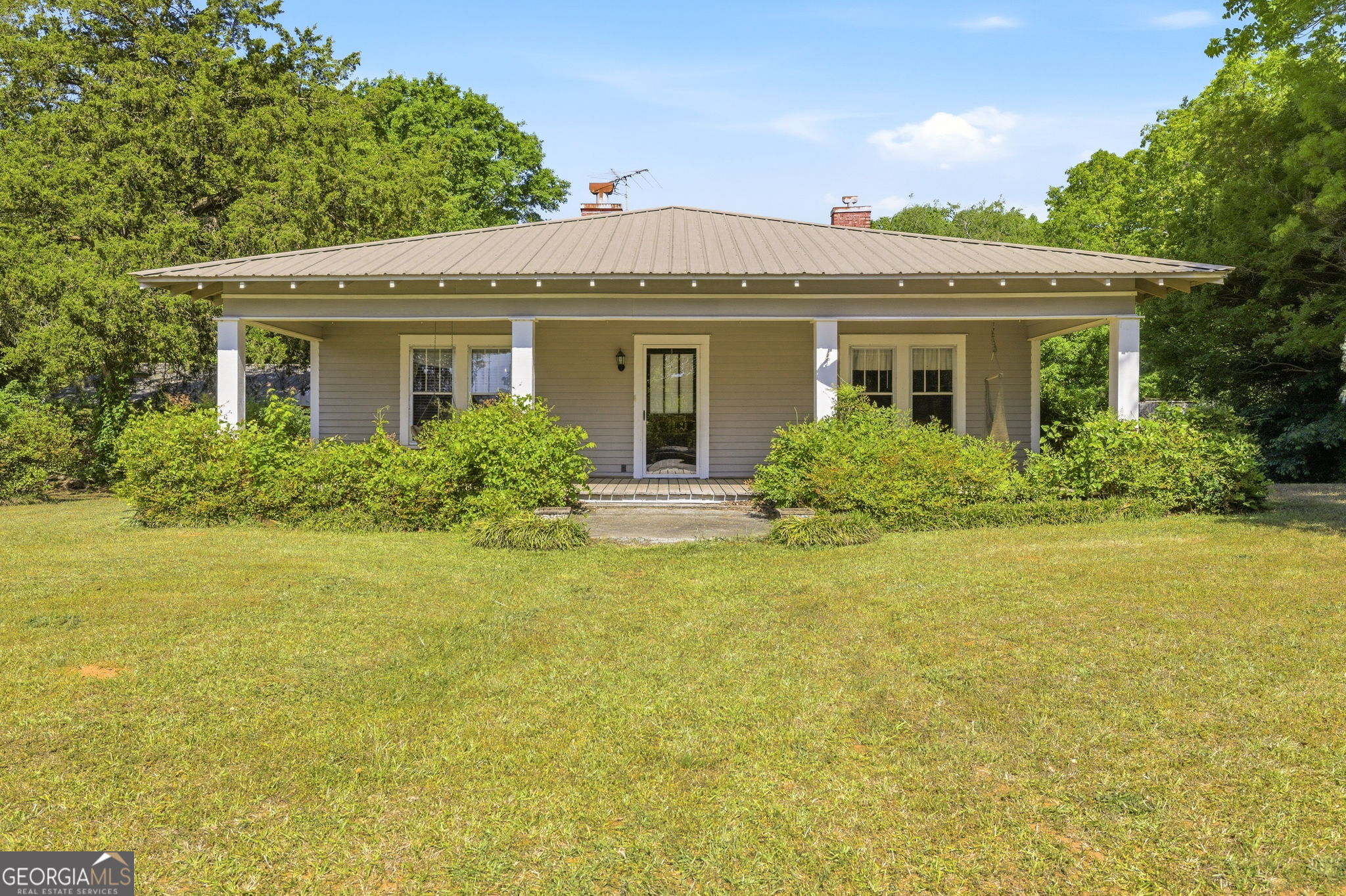 a front view of house with an outdoor space