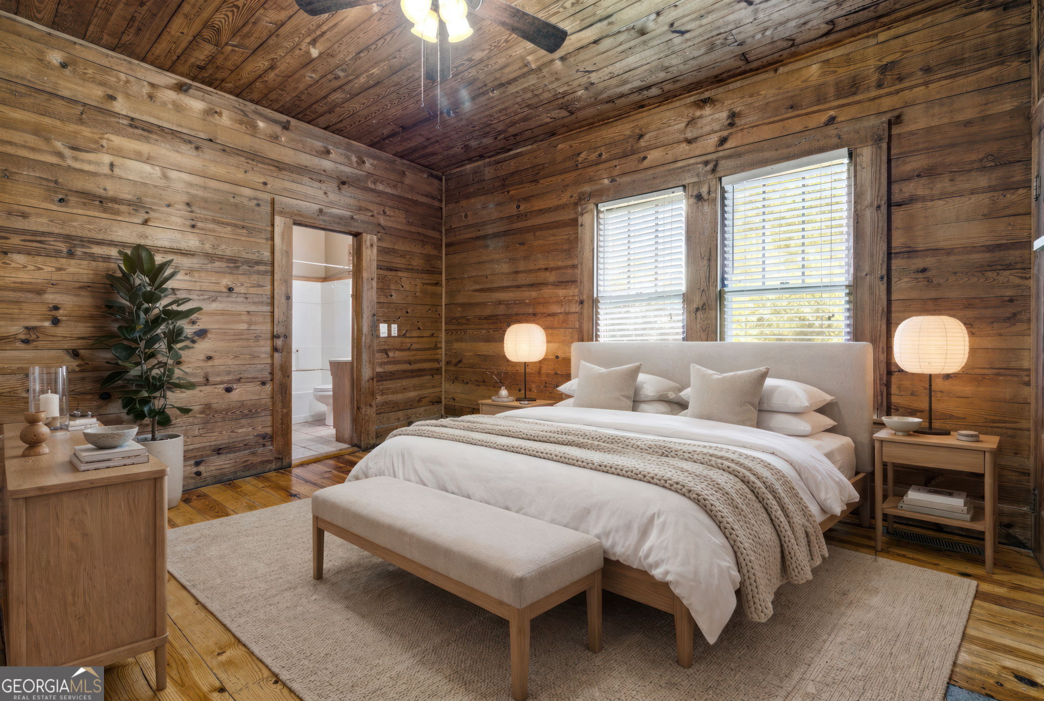 3213 Highway 326 Commerce, GA 30530 - Photo 12 of 40 a bedroom with a bed and a chandelier
