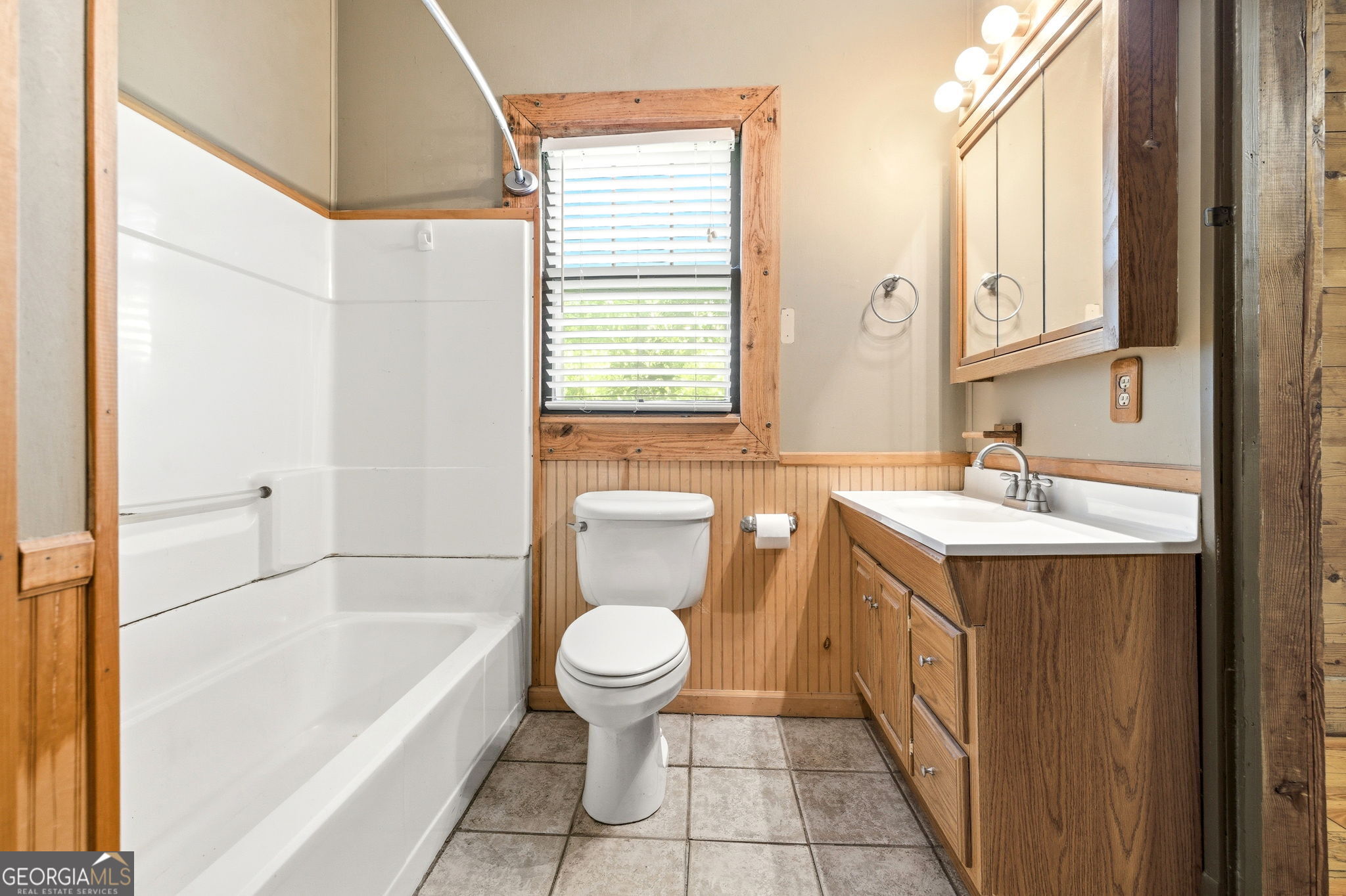 3213 Highway 326 Commerce, GA 30530 - Photo 18 of 40 a bathroom with a sink a toilet and bathtub