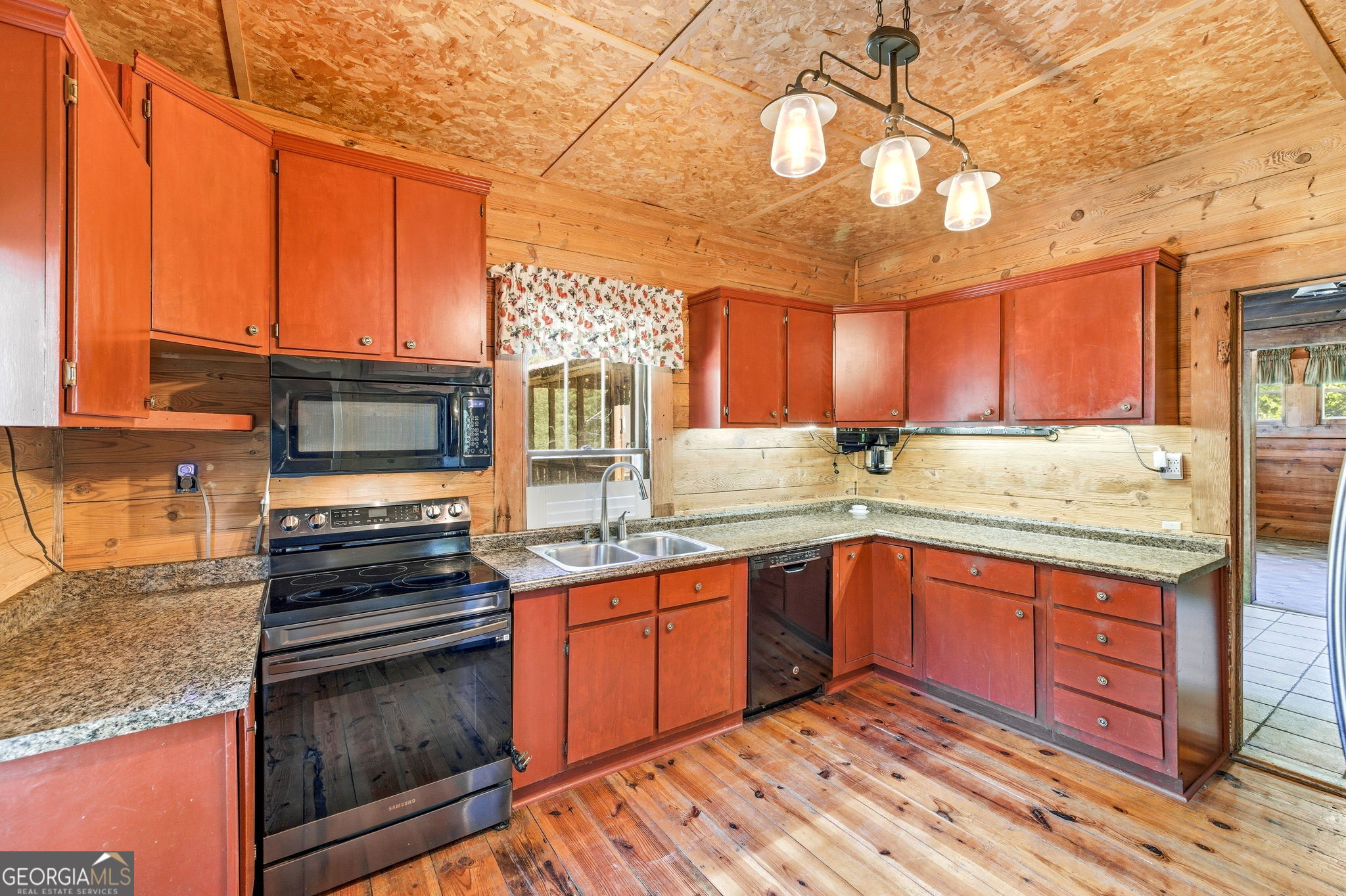 3213 Highway 326 Commerce, GA 30530 - Photo 21 of 40 a kitchen with stainless steel appliances granite countertop a stove and a sink
