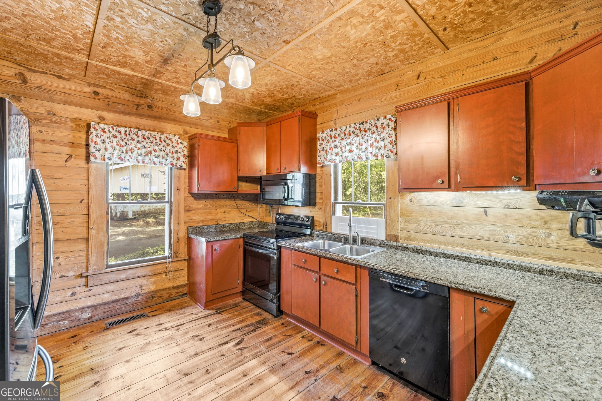 3213 Highway 326 Commerce, GA 30530 - Photo 22 of 40 a kitchen with stainless steel appliances granite countertop sink stove and granite counter top