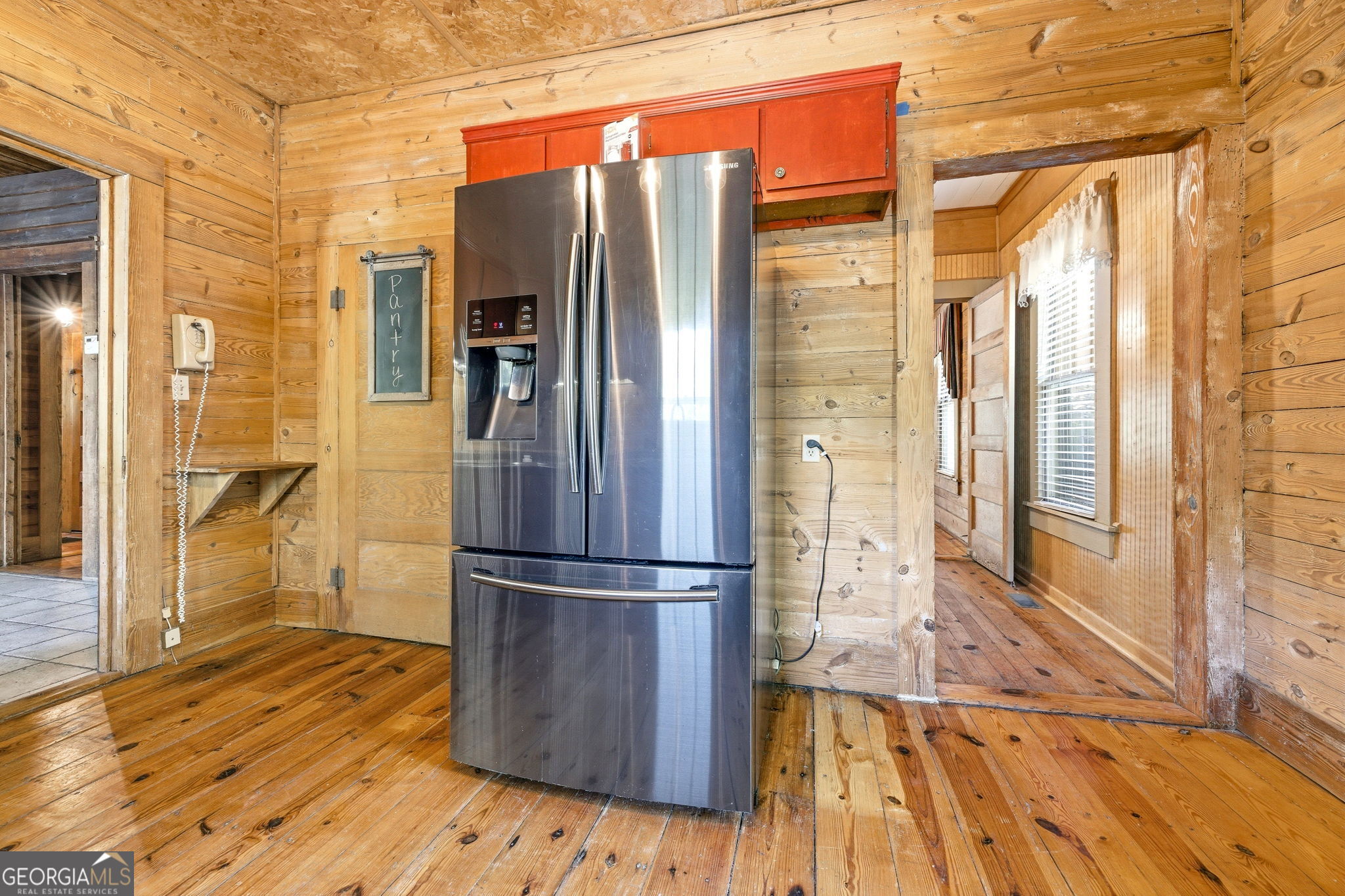 3213 Highway 326 Commerce, GA 30530 - Photo 23 of 40 a kitchen with stainless steel appliances granite countertop a refrigerator and a wooden floors