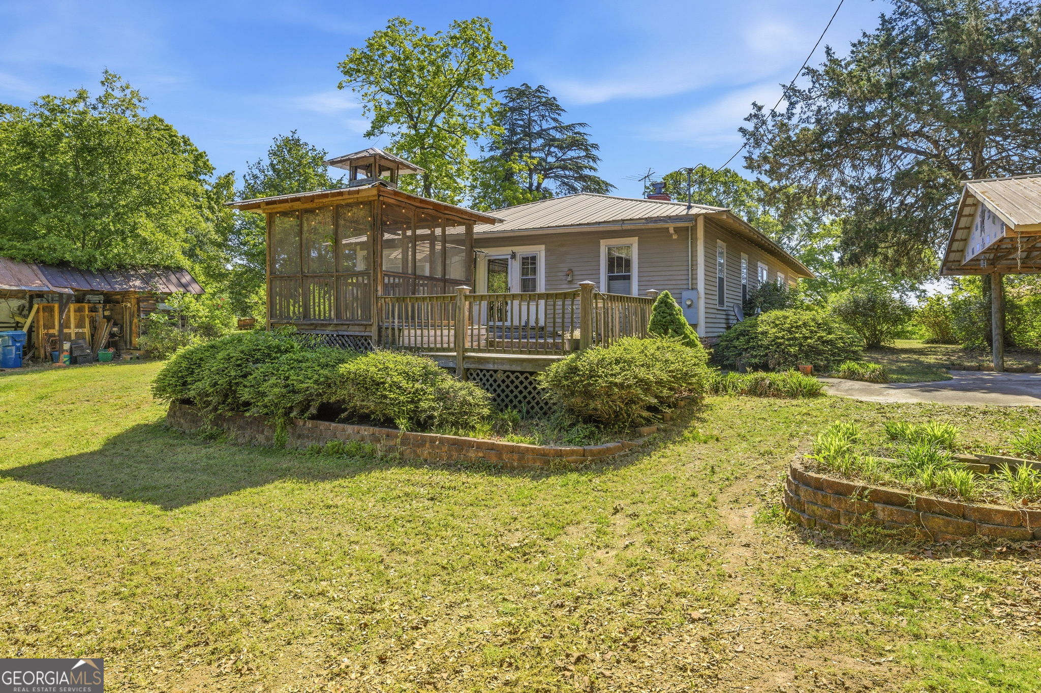 3213 Highway 326 Commerce, GA 30530 - Photo 27 of 40 a front view of a house with garden