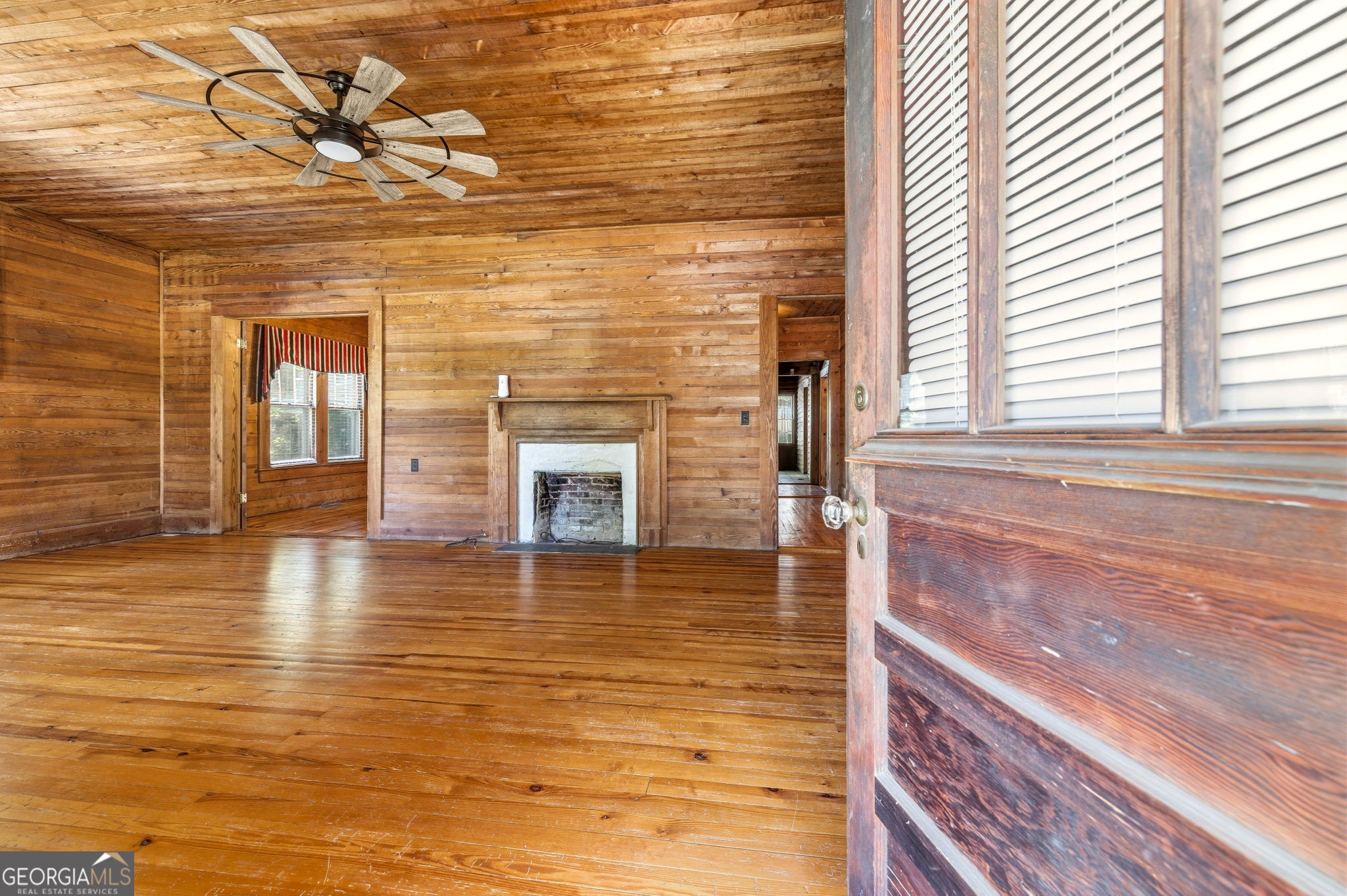 3213 Highway 326 Commerce, GA 30530 - Photo 5 of 40 a view of a livingroom with wooden floor and a window