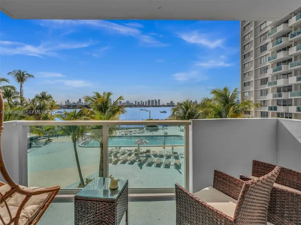 a view of balcony with furniture
