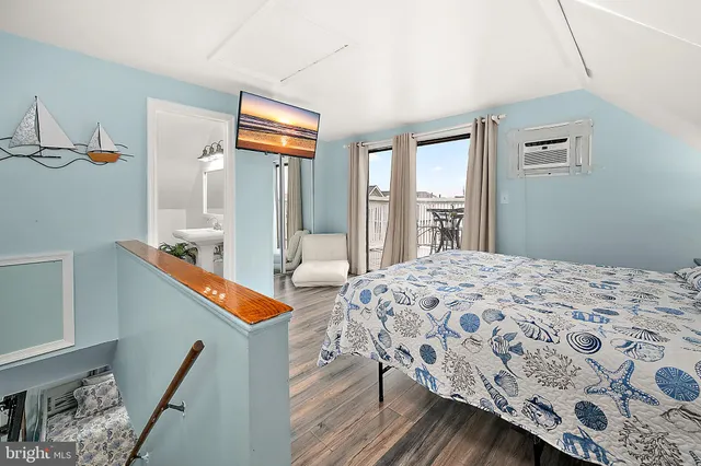 a bedroom with a bed and a couch