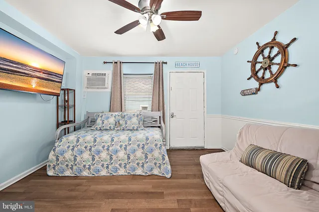 an aerial view of a residential building with parking