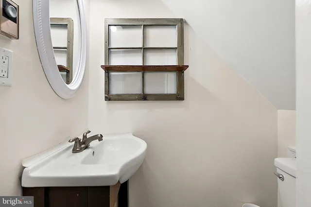 a bathroom with a sink and toilet