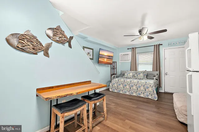 an aerial view of a residential apartment building with a yard