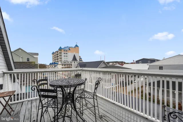 a bedroom with furniture and a wooden floor