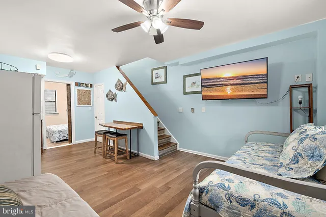 a view of a livingroom with furniture and wooden floor