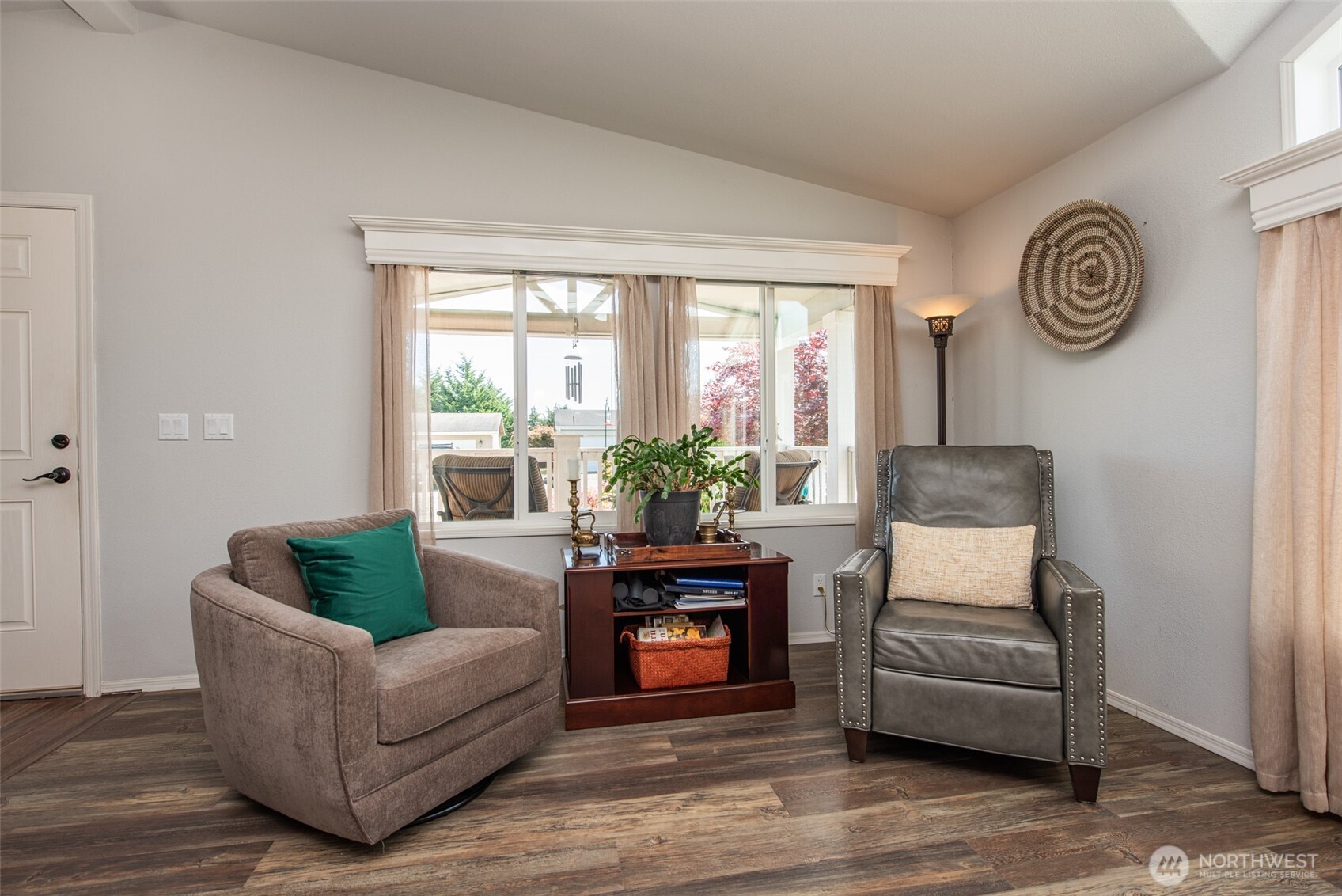 720 West Heritage Loop Sequim, WA 98382 - Photo 14 of 35 a living room with furniture and a large window