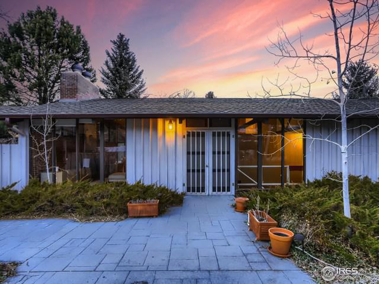 421 Baseline Road Boulder, CO 80302 - Photo 9 of 17 a view of a house with potted plants and a table and chair