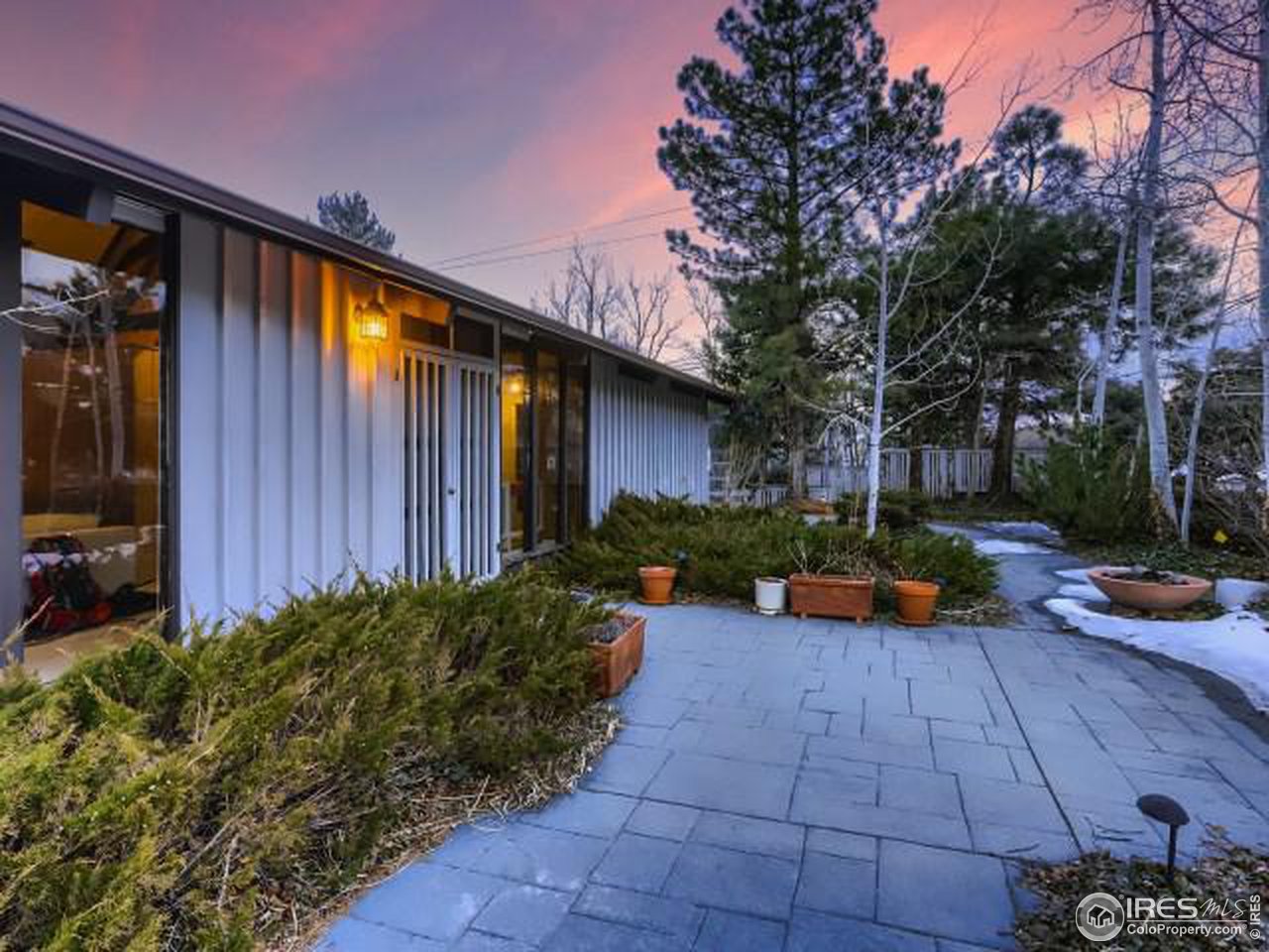 421 Baseline Road Boulder, CO 80302 - Photo 10 of 17 a view of a backyard with plants and a patio