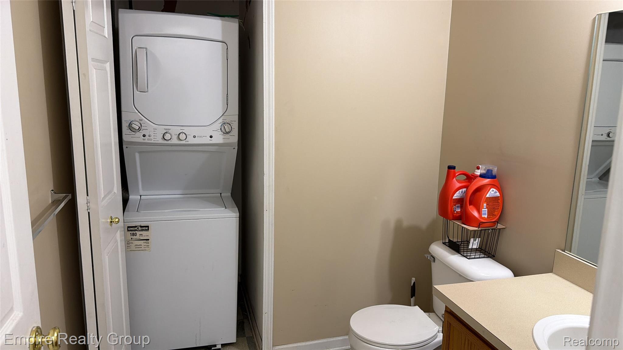 4334 Schaefer Road Dearborn, MI 48126 - Photo 3 of 9 Half bathroom with stacked washer / dryer and vanity
