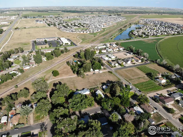 an aerial view of a residential building and lake view
