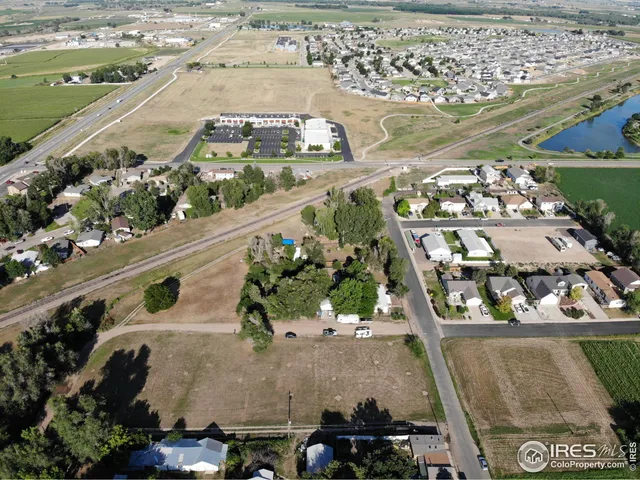 an aerial view of a residential building and lake view